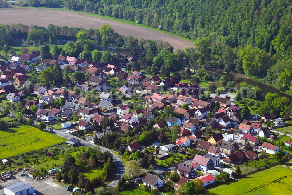 Aerial photograph Ebenshausen - Surrounded by forest and forest areas center of the streets and houses and residential areas in Ebenshausen in the state Thuringia, Germany