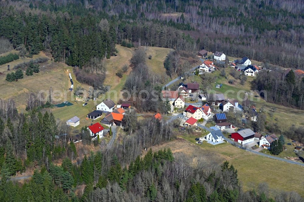 Eichig from above - Surrounded by forest and forest areas center of the streets and houses and residential areas in Eichig in the state Bavaria, Germany