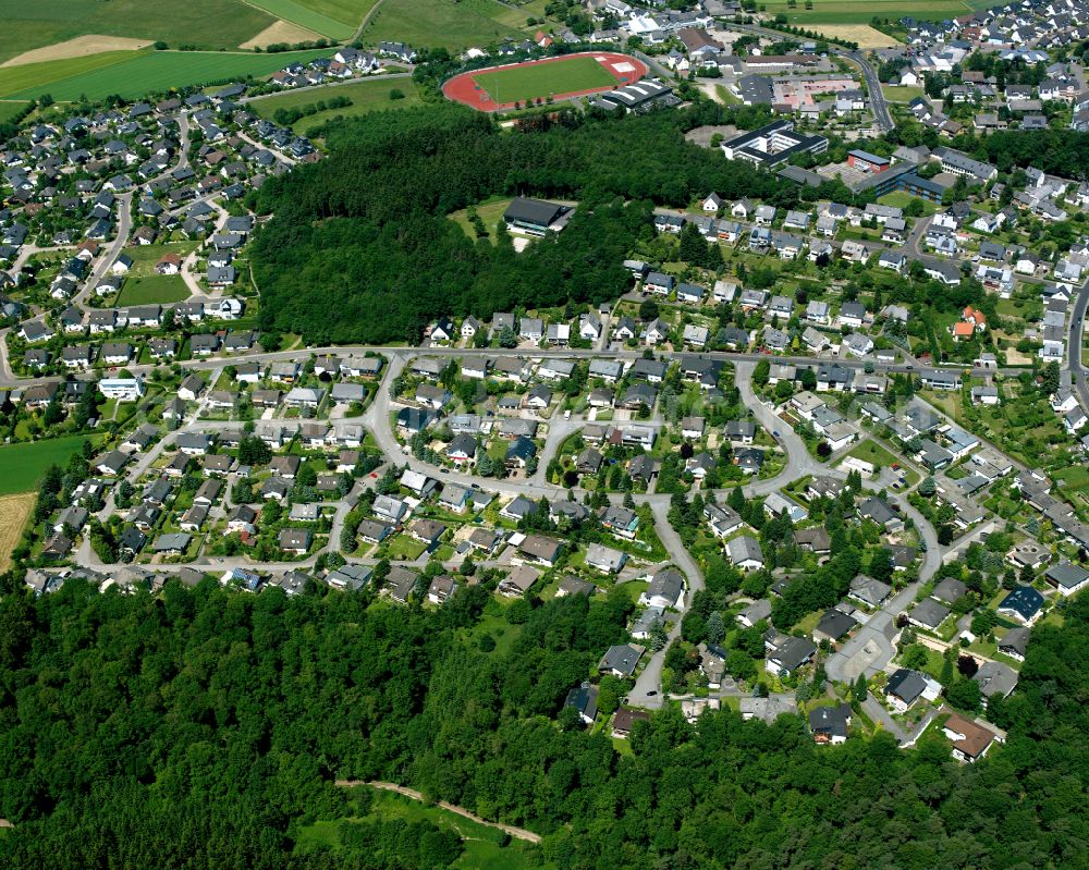 Aerial photograph Emmelshausen - Surrounded by forest and forest areas center of the streets and houses and residential areas in Emmelshausen in the state Rhineland-Palatinate, Germany