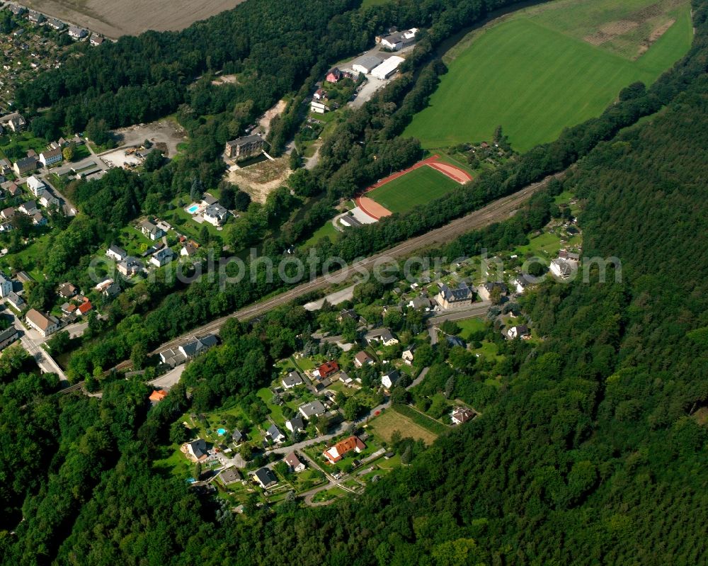 Aerial photograph Erdmannsdorf - Surrounded by forest and forest areas center of the streets and houses and residential areas in Erdmannsdorf in the state Saxony, Germany