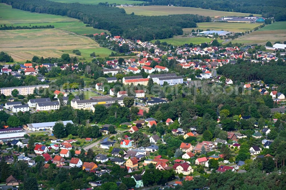 Aerial photograph Klosterfelde - Surrounded by forest and forest areas center of the streets and houses and residential areas in Klosterfelde in the state Brandenburg, Germany