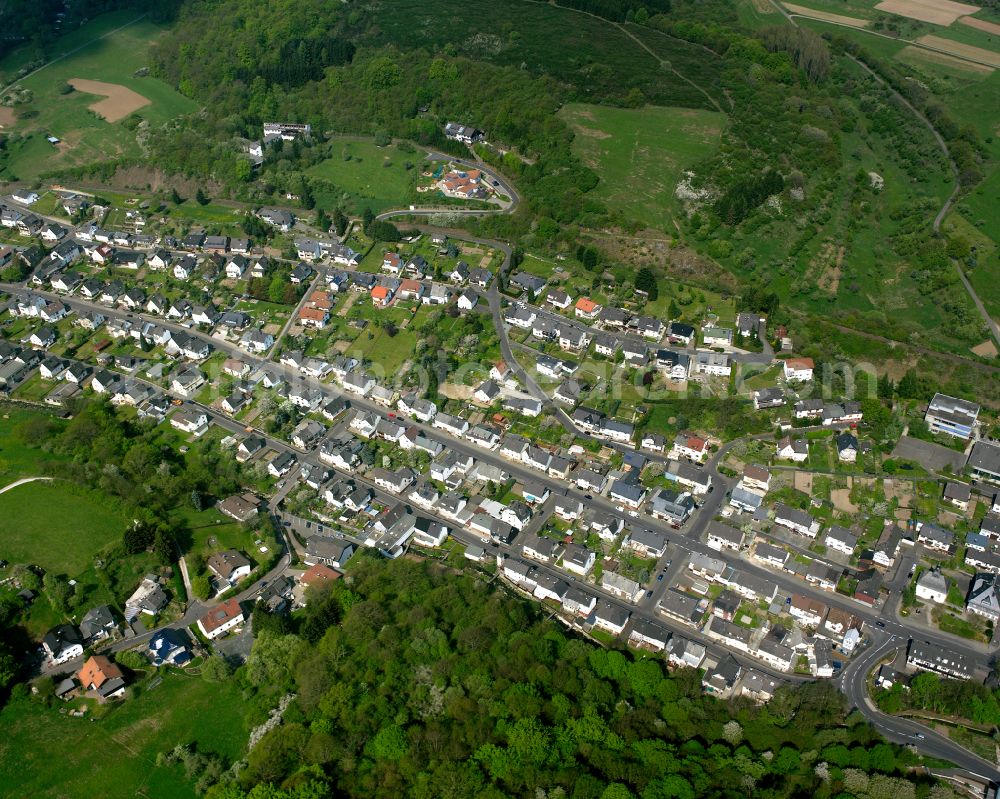 Langenaubach from above - Surrounded by forest and forest areas center of the streets and houses and residential areas in Langenaubach in the state Hesse, Germany
