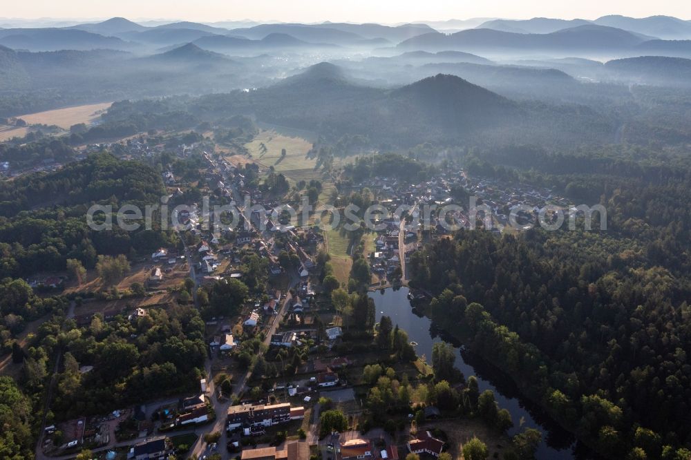 Aerial image Ludwigswinkel - Surrounded by forest and forest areas center of the streets and houses and residential areas in Ludwigswinkel in the state Rhineland-Palatinate, Germany