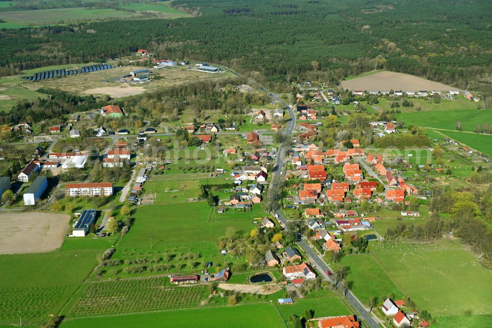 Aerial photograph Malliß - Surrounded by forest and forest areas center of the streets and houses and residential areas in Malliss in the state Mecklenburg - Western Pomerania, Germany