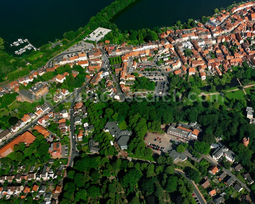 Aerial image Mölln - Surrounded by forest and forest areas center of the streets and houses and residential areas in Mölln in the state Schleswig-Holstein, Germany