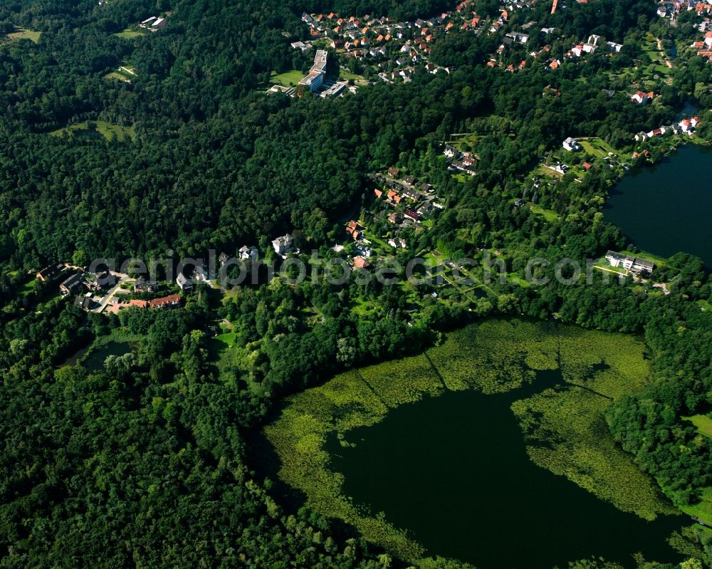 Aerial photograph Mölln - Surrounded by forest and forest areas center of the streets and houses and residential areas in Mölln in the state Schleswig-Holstein, Germany