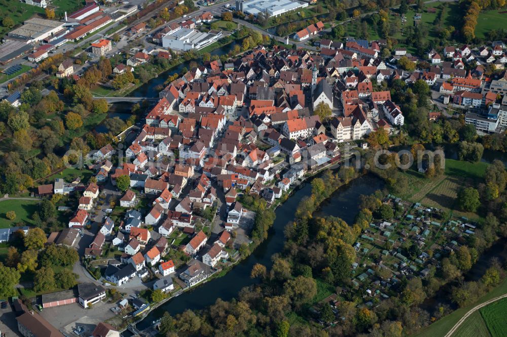 Munderkingen from above - Surrounded by forest and forest areas center of the streets and houses and residential areas in Munderkingen in the state Baden-Wuerttemberg, Germany