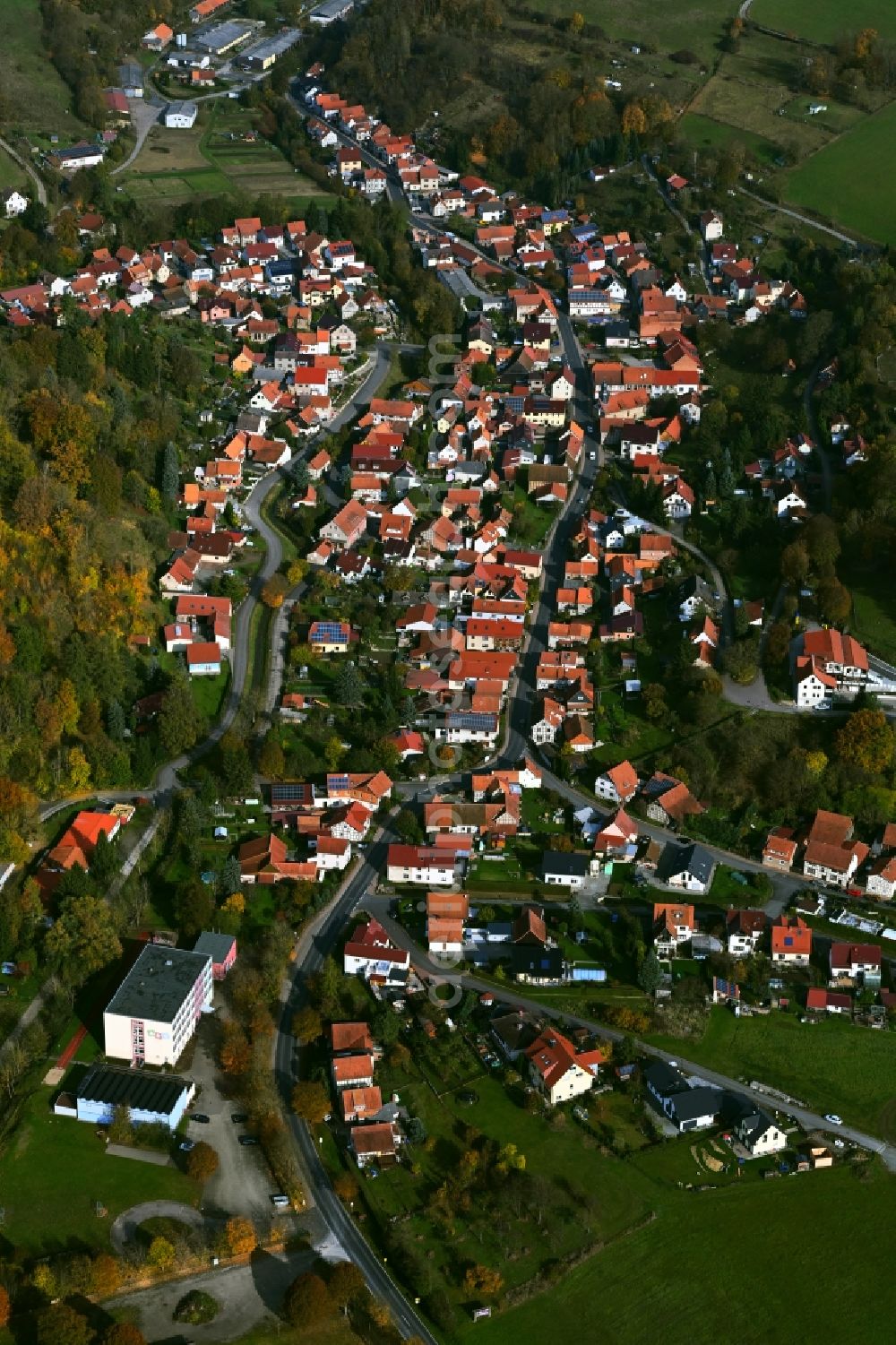 Aerial image Nazza - Surrounded by forest and forest areas center of the streets and houses and residential areas in Nazza in the state Thuringia, Germany