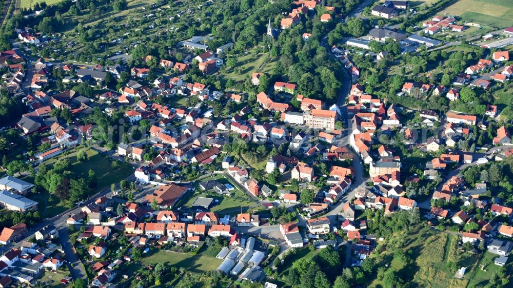 Aerial image Neinstedt - Surrounded by forest and forest areas center of the streets and houses and residential areas in Neinstedt in the state Saxony-Anhalt, Germany