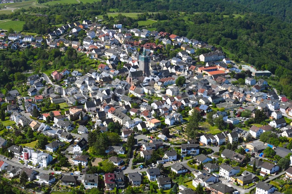 Rauenthal from above - Surrounded by forest and forest areas center of the streets and houses and residential areas in Rauenthal in the state Hesse, Germany