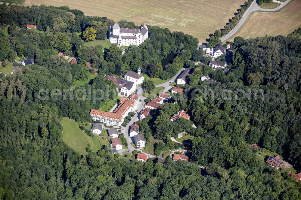 Kronwinkl from above - Village and castle surrounded by forest and forest areas in Kronwinkl in the state Bavaria, Germany