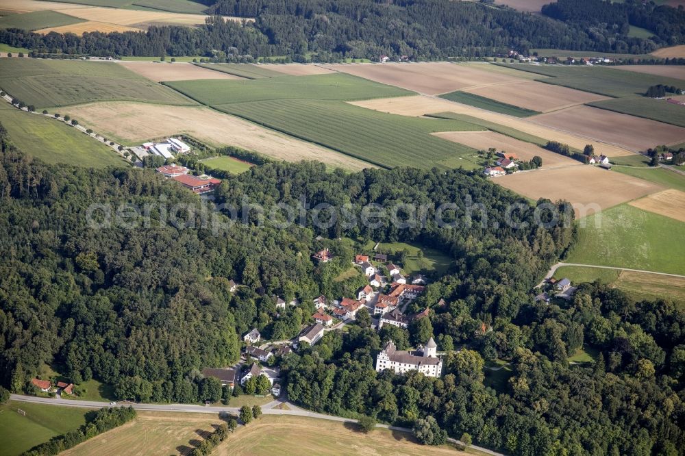 Kronwinkl from the bird's eye view: Village and castle surrounded by forest and forest areas in Kronwinkl in the state Bavaria, Germany