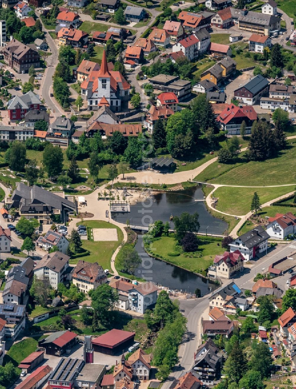 Aerial image Schonach im Schwarzwald - Surrounded by forest and forest areas center of the streets and houses and residential areas in Schonach im Schwarzwald in the state Baden-Wuerttemberg, Germany
