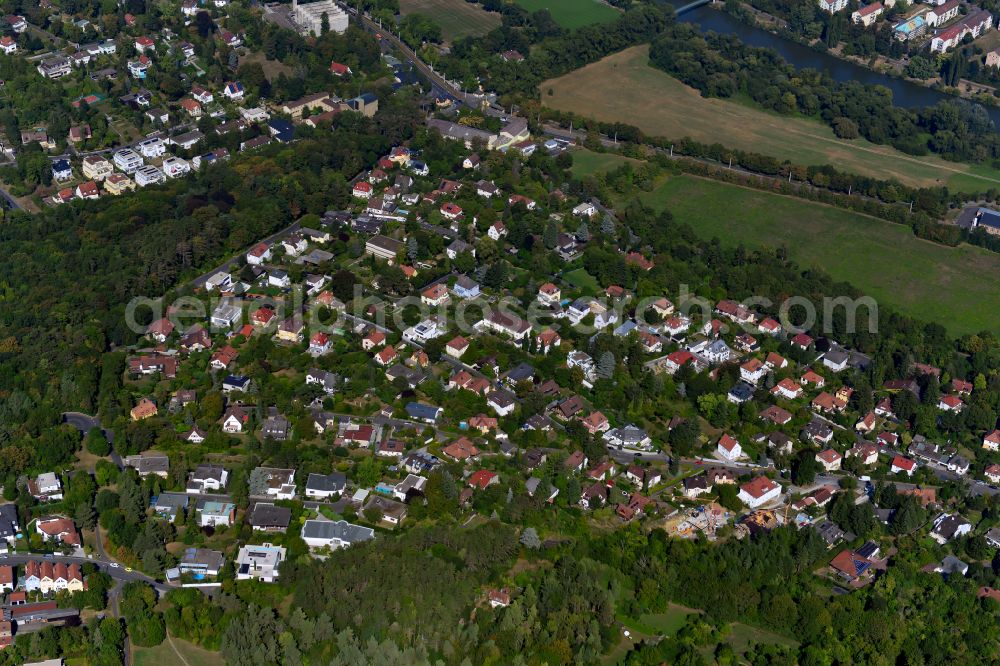 Steinbachtal from above - Surrounded by forest and forest areas center of the streets and houses and residential areas in Steinbachtal in the state Bavaria, Germany
