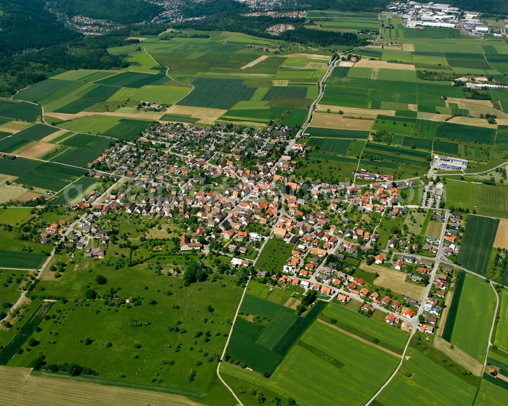 Aerial image Vollmaringen - Surrounded by forest and forest areas center of the streets and houses and residential areas in Vollmaringen in the state Baden-Wuerttemberg, Germany