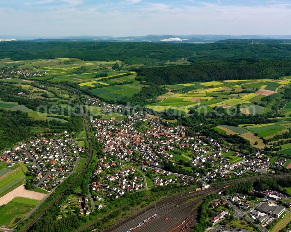 Weiterode from above - Surrounded by forest and forest areas center of the streets and houses and residential areas in Weiterode in the state Hesse, Germany