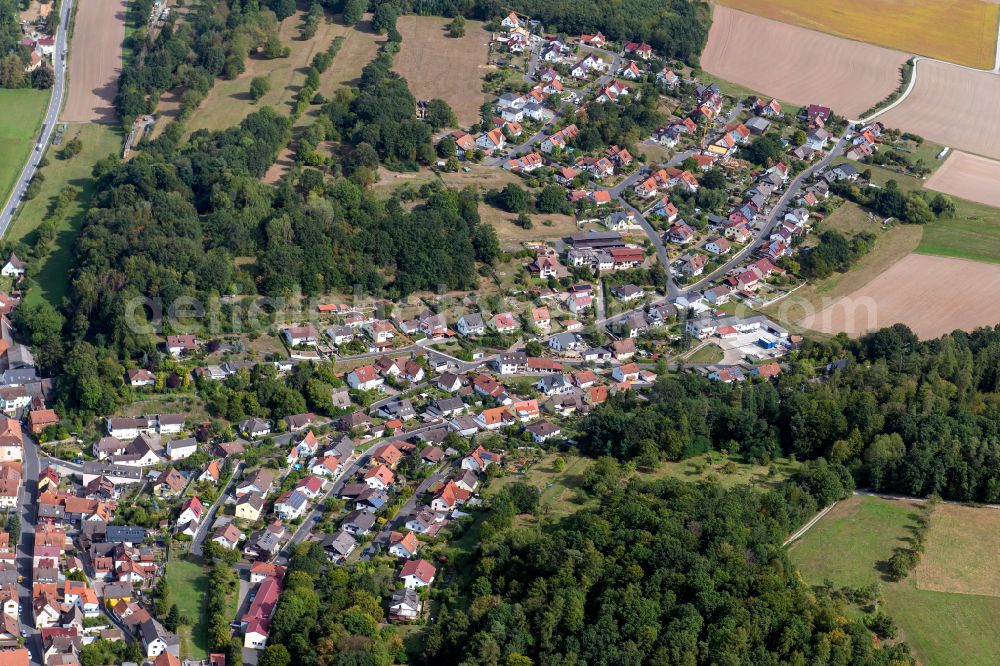 Aerial photograph Wernfeld - Surrounded by forest and forest areas center of the streets and houses and residential areas in Wernfeld in the state Bavaria, Germany