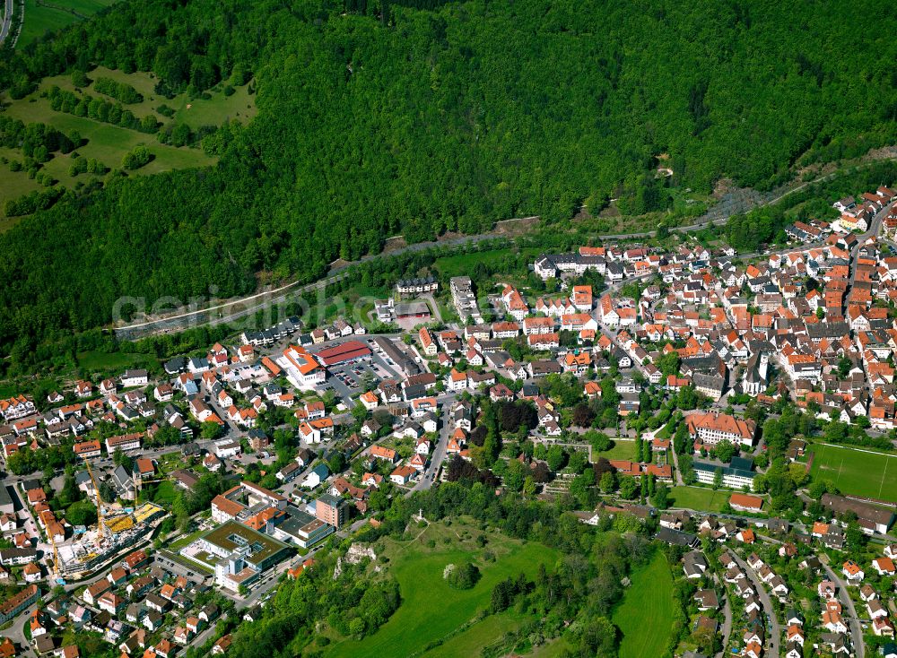 Blaubeuren from above - Urban area with outskirts and inner city area surrounded by woodland and forest areas in Blaubeuren in the state Baden-Wuerttemberg, Germany