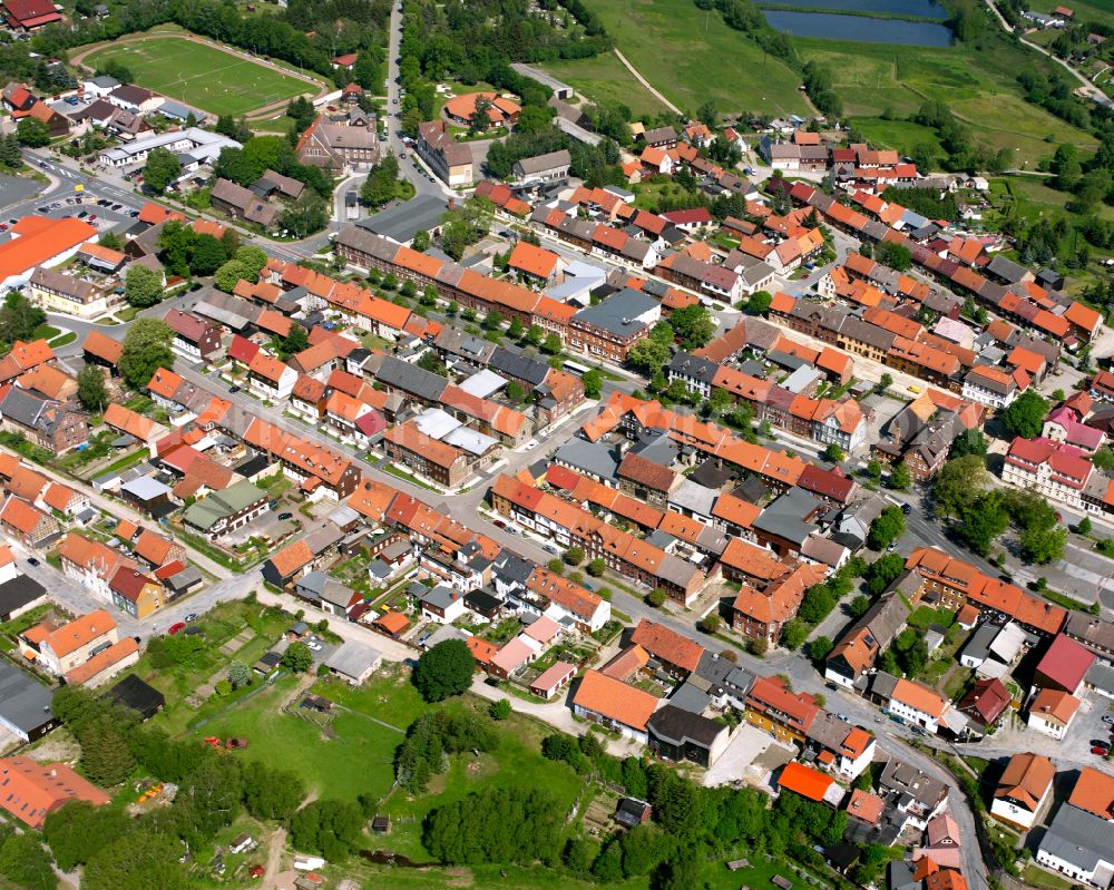 Hasselfelde from above - Urban area with outskirts and inner city area surrounded by woodland and forest areas in Hasselfelde in the state Saxony-Anhalt, Germany