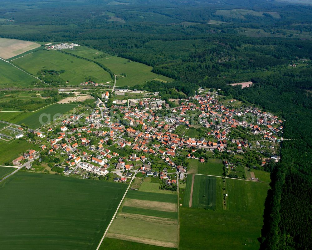 Hüttenrode from the bird's eye view: Urban area with outskirts and inner city area surrounded by woodland and forest areas in Hüttenrode in the state Saxony-Anhalt, Germany