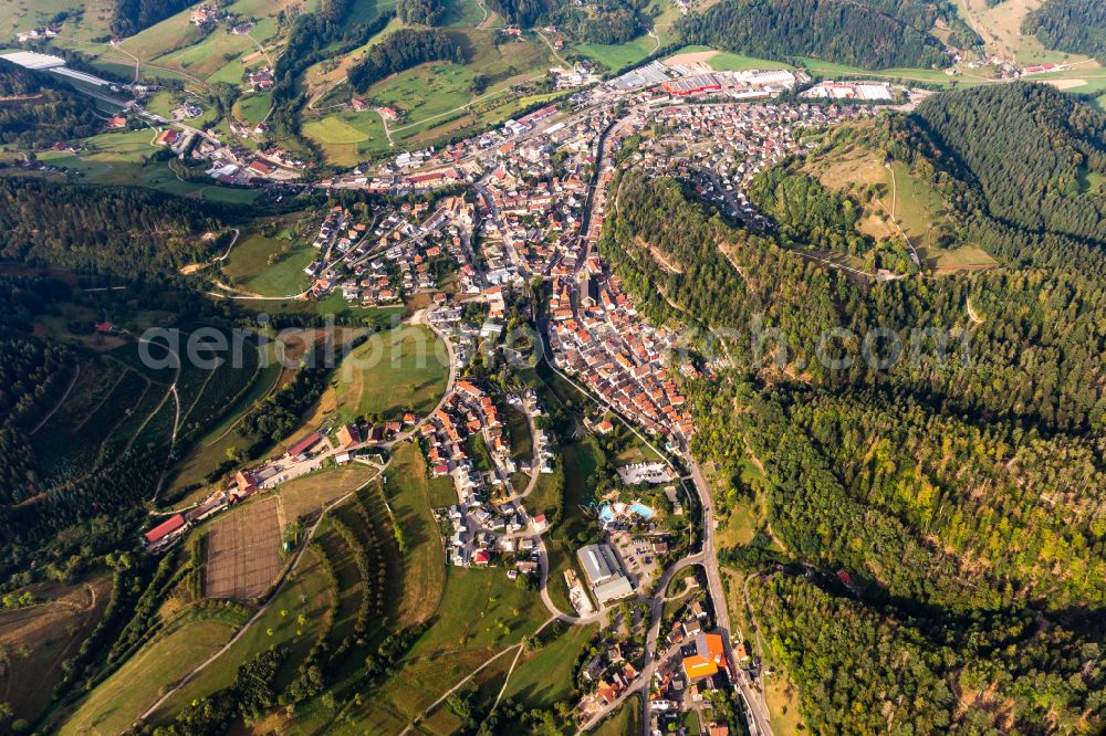 Oppenau from above - Urban area with outskirts and inner city area surrounded by woodland and forest areas in Oppenau in the state Baden-Wuerttemberg, Germany