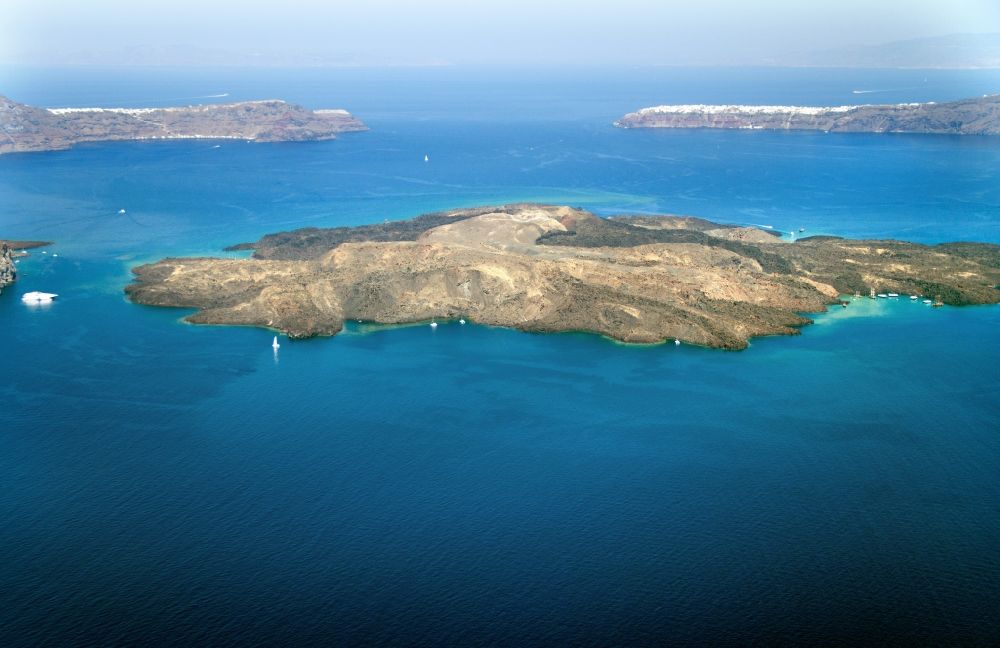 Nea Palemi from above - Volcanic island of Nea Palemi in the archipelago of Santorini in Greece. The uninhabited volcanic island in the Southern Aegean sea belongs to the municipality of Thira in the region of South Aegean