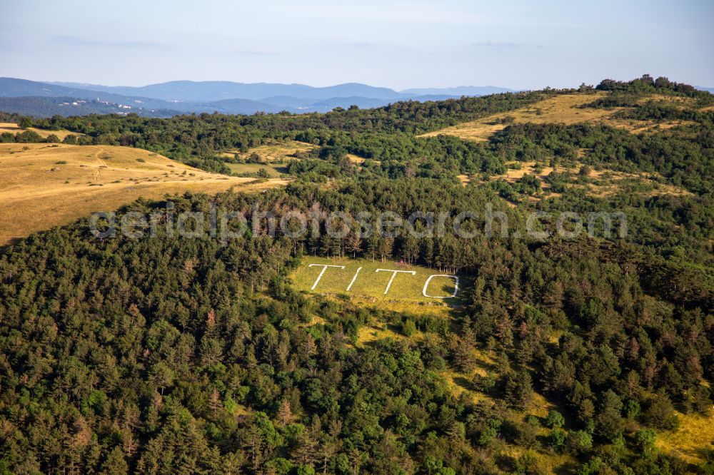 Aerial photograph Branik - Forest and mountain scenery with riesiger Markierung TITO in einer Lichtung in Branik in Nova Gorica, Slovenia