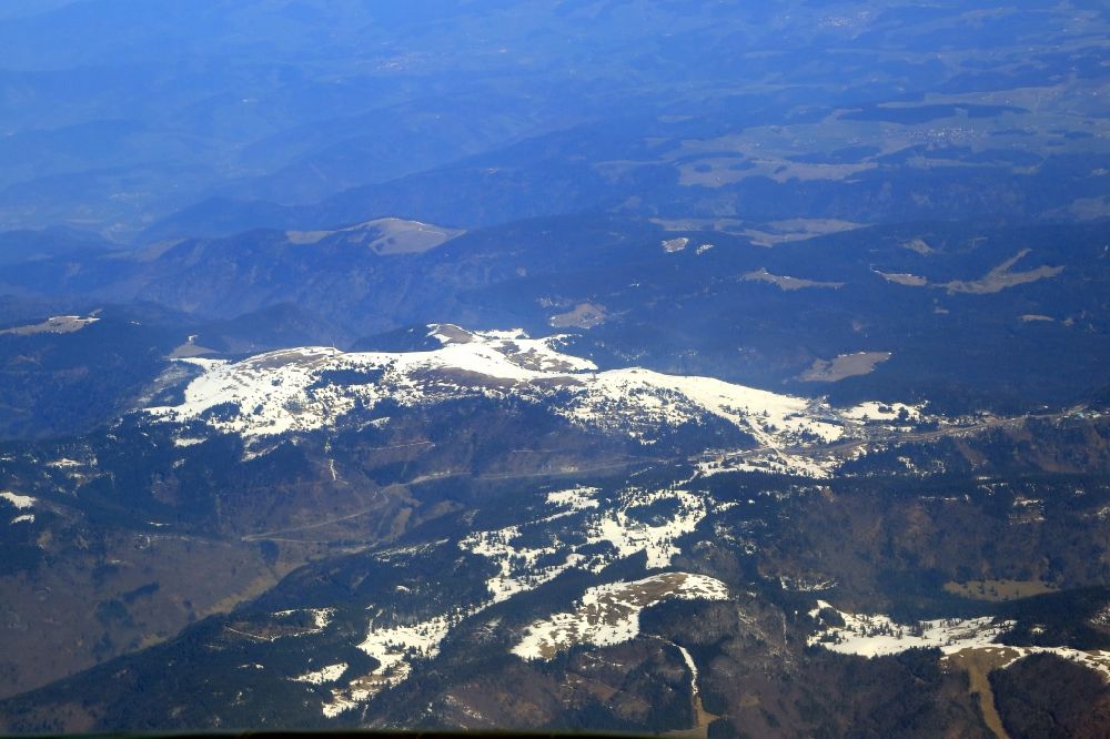 Aerial image Feldberg (Schwarzwald) - Forest and mountain scenery in the Black Forest with last snow fields on the summit of mount Feldberg and Herzogenhorn in Feldberg (Black Forest) in the state Baden-Wurttemberg, Germany