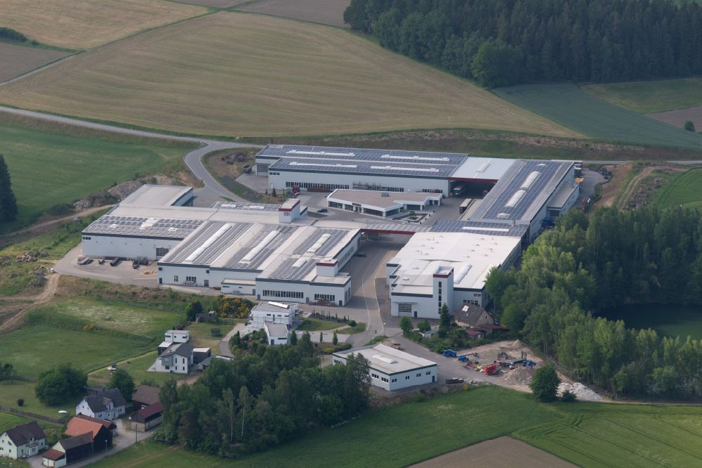 Aerial photograph Waidhaus - Industrial and commercial area in the middle of a wooded area Waidhaus on street Am Spatwerk in Waidhaus in the state Bavaria, Germany