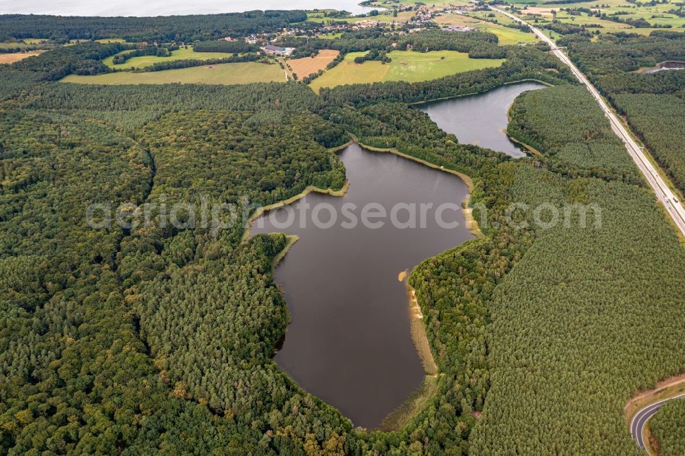 Althüttendorf from above - Forests on the shores of Lake Tiefer Bugsinsee in Althuettendorf in the state Brandenburg, Germany