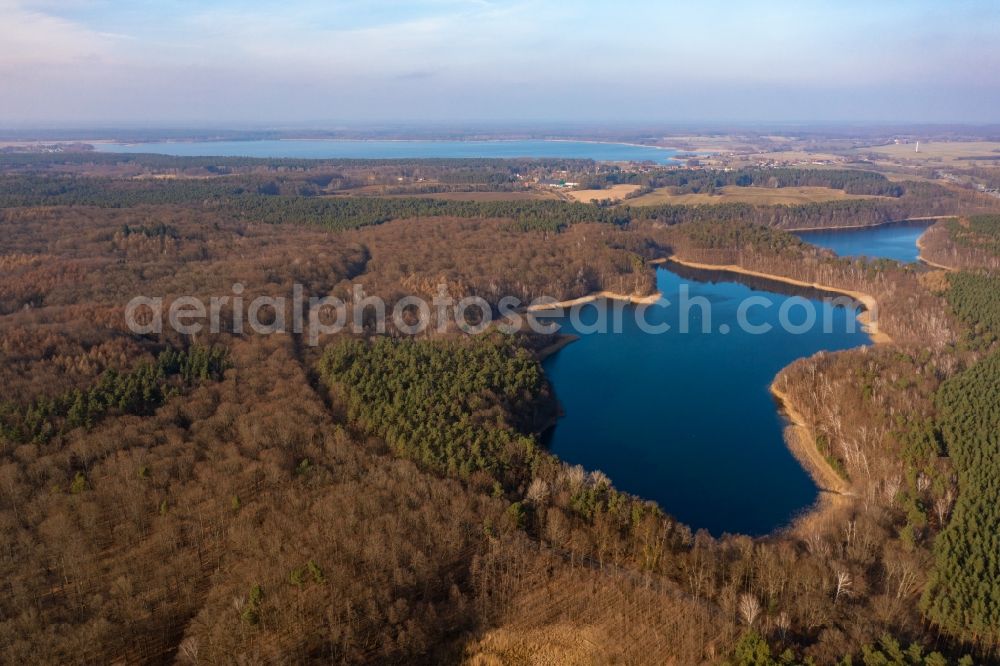 Althüttendorf from above - Forests on the shores of Lake Tiefer Bugsinsee in Althuettendorf in the state Brandenburg, Germany