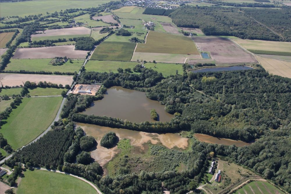 Aerial image Montreuil-sur-Loir - Forests and fields on the shores of a lake near Montreuil-sur-Loir in Pays de la Loire, France