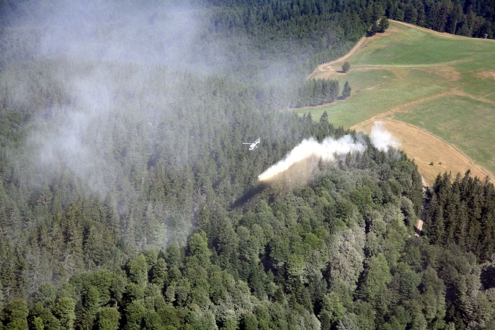 Münstertal/Schwarzwald from above - Lime is spread by helicopter, to prevent acidification of the forest soil in the area of Muenstertal / Schwarzwald in Baden-Wuerttemberg. Acid rain favored in the high altitudes of the southern Black Forest the destruction of the forests