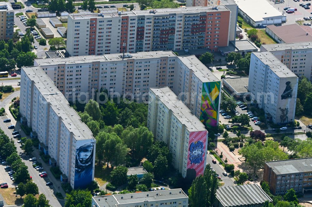 Aerial image Berlin - Wall painting on prefabricated high-rise buildings in the residential area of an industrially manufactured prefabricated housing estate on Zossener Strasse - Alte Hellersdorfer Strasse in the Hellersdorf district in Berlin, Germany