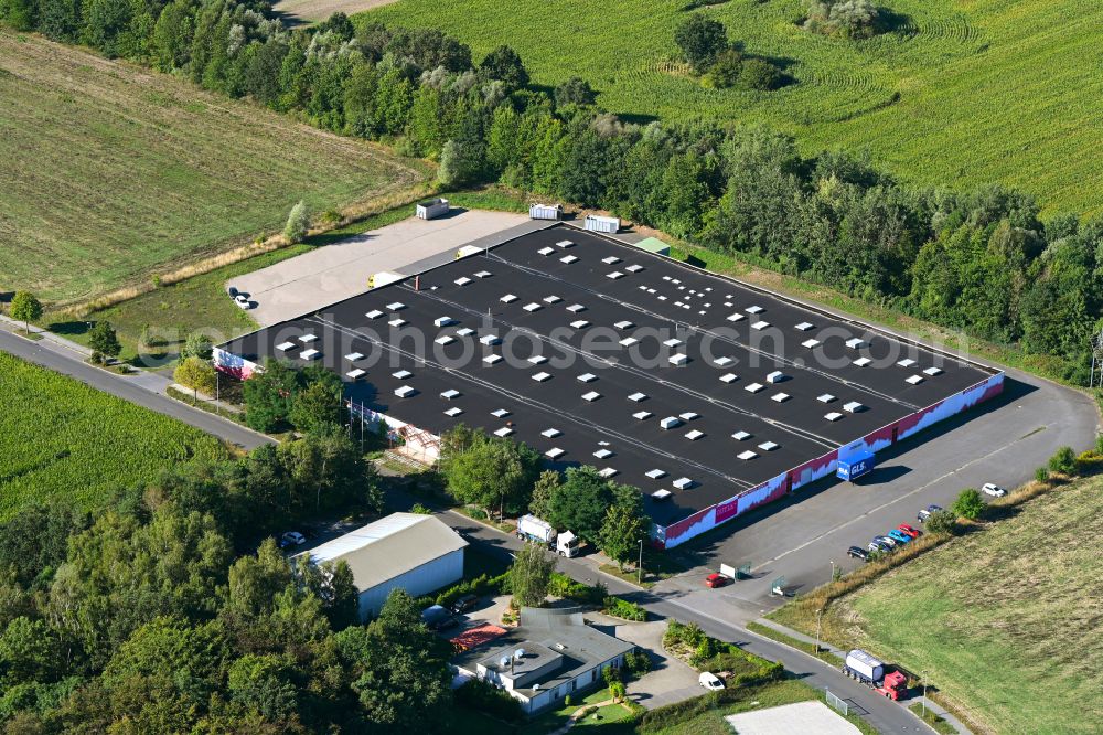 Aerial image Falkenhagen - Warehouse of the WECON home GmbH Zentrallager and the BBM Moebelhaus GmbH on the street Am Huenengrab in Falkenhagen in the state Brandenburg, Germany