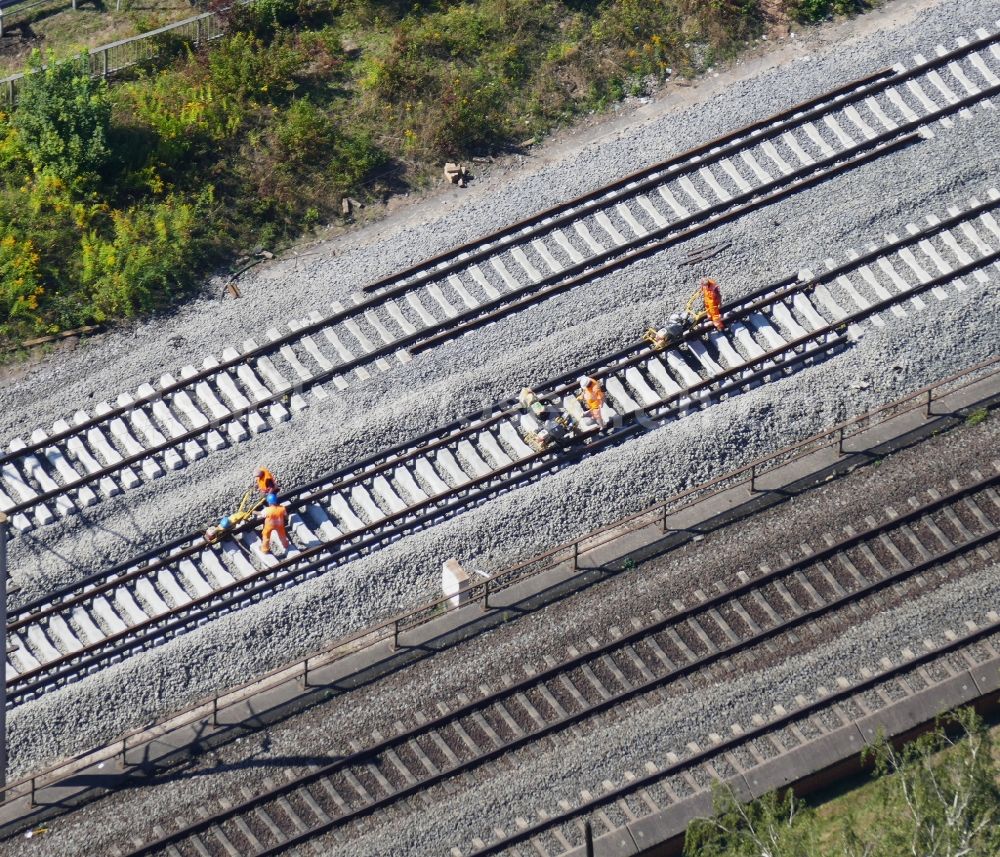 Bovenden from the bird's eye view: Maintenance work on a rail track and overhead wiring harness in the route network of the Deutsche Bahn in the district Harste in Bovenden in the state Lower Saxony, Germany