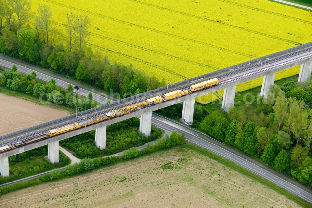 Rosdorf from the bird's eye view: Maintenance work on a rail track and overhead wiring harness in the route network of the Deutsche Bahn in Rosdorf in the state Lower Saxony, Germany