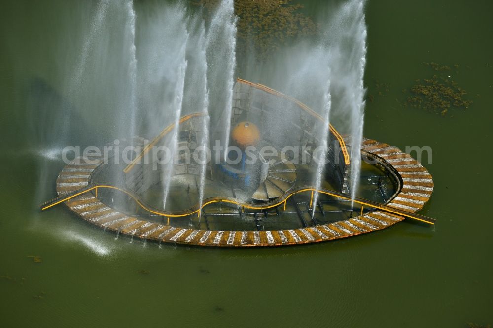 Bukarest from above - Water Fontaine in the lake Lacul Plumboita in the city center of the capital city of Bucharest in Romania