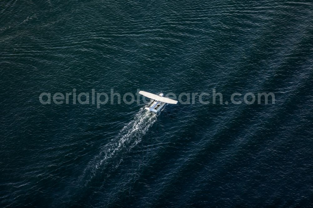 Flensburg from above - Seaplane taking off on the Flensburg Fjord in the state Schleswig-Holstein, Germany