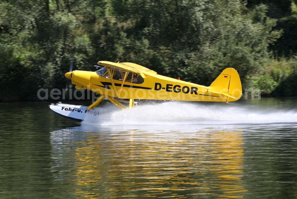 Aerial image Zeltingen-Rachtig - Seaplane Piper PA-18 Super Cub on the Moselle with pines in Zeltingen in the state Rhineland-Palatinate. No use for reports on aviation accidents