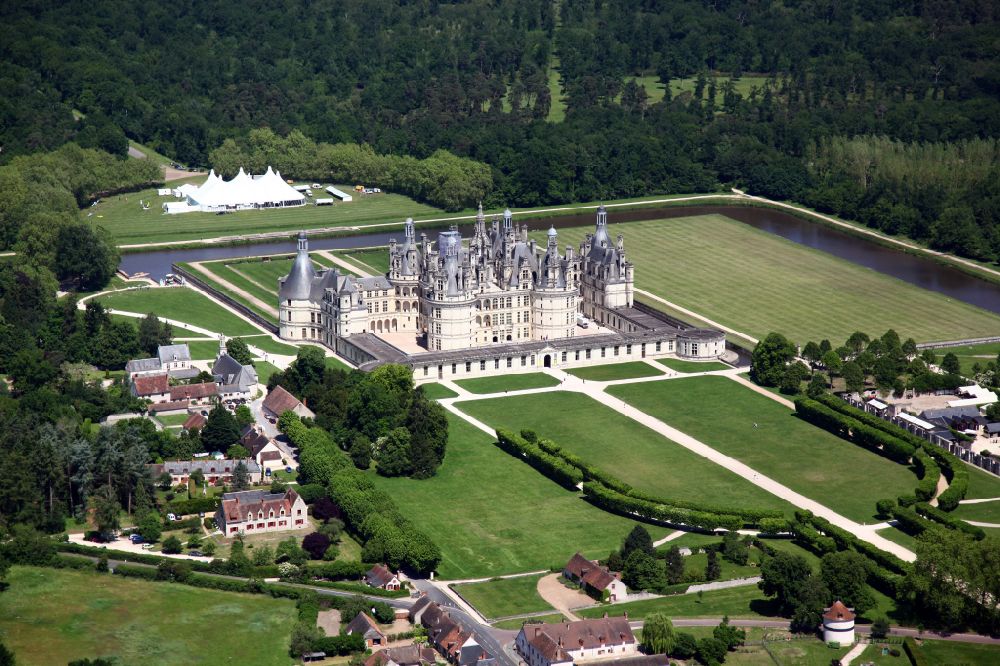 Chambord from above - Building and castle park systems of water castle Chateau de Chambord on street Le Chateau in Chambord in Centre-Val de Loire, France