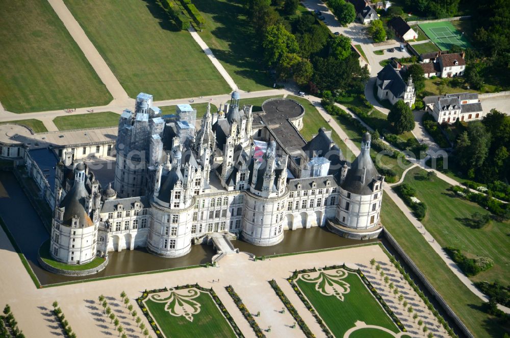 Chambord from above - Building and castle park systems of water castle Chateau de Chambord on street Le Chateau in Chambord in Centre-Val de Loire, France