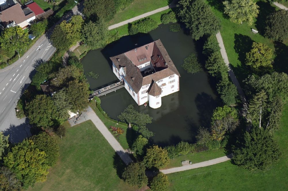 Inzlingen from above - Building and castle park systems of moated castle Reichensteinwith restaurant and town hall in Inzlingen in the state Baden-Wurttemberg, Germany