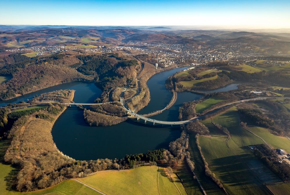 Olpe from the bird's eye view: Low water level and lack of water caused the shoreline areas to be exposed of Biggesee in Olpe in the state North Rhine-Westphalia, Germany