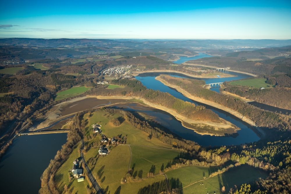 Aerial image Olpe - Low water level and lack of water caused the shoreline areas to be exposed of Biggesee in Olpe in the state North Rhine-Westphalia, Germany