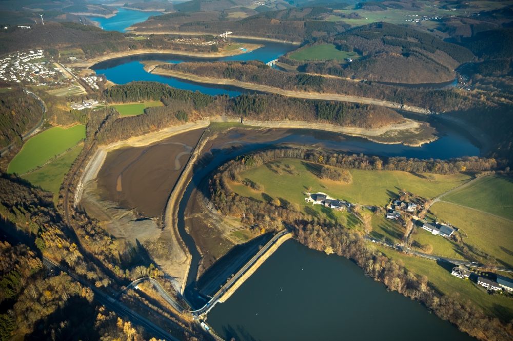 Aerial photograph Olpe - Low water level and lack of water caused the shoreline areas to be exposed of Biggesee in Olpe in the state North Rhine-Westphalia, Germany