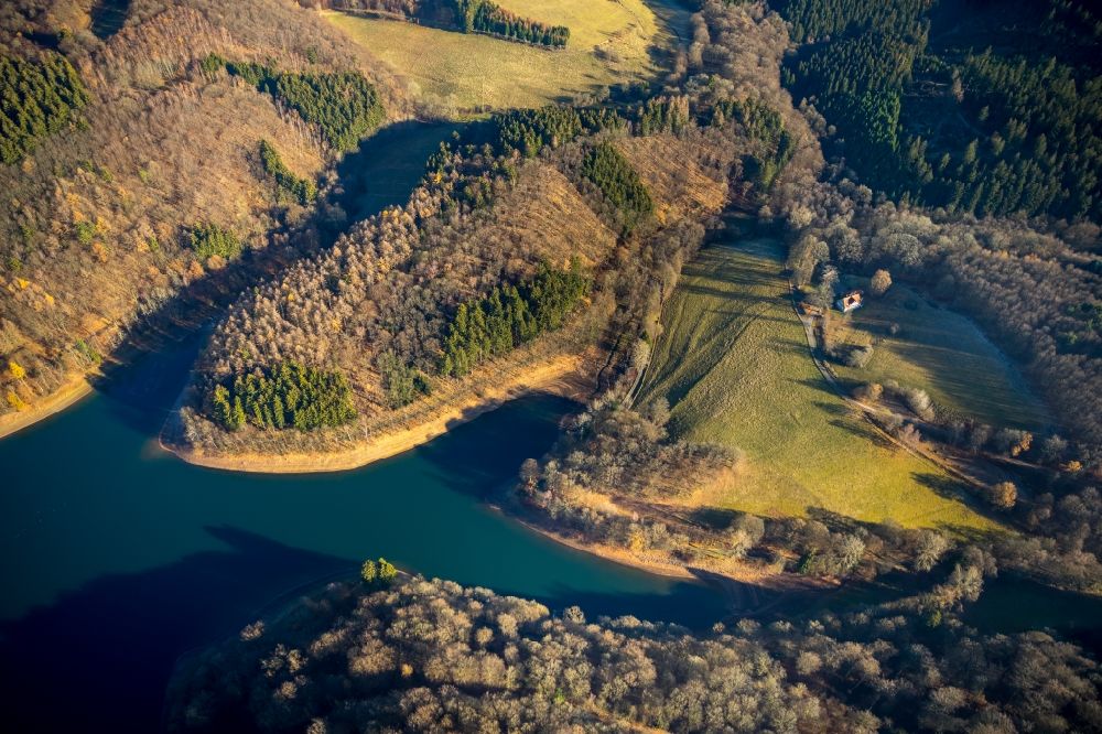 Aerial image Meinerzhagen - Low water level and lack of water caused the shoreline areas to be exposed of Fuerwigge- Talsperre in Meinerzhagen in the state North Rhine-Westphalia, Germany