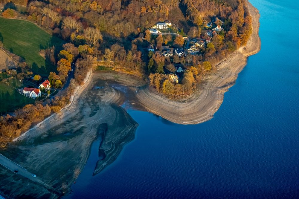 Möhnesee from above - Low water level and lack of water caused the shoreline areas to be exposed of Stausees on Moehnetalsperre in Moehnesee in the state North Rhine-Westphalia, Germany