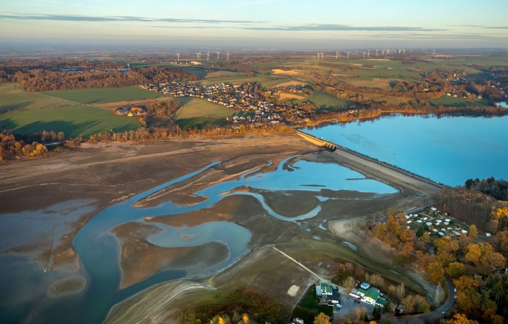 Möhnesee from above - Low water level and lack of water caused the shoreline areas to be exposed of Stausees on Moehnetalsperre in Moehnesee in the state North Rhine-Westphalia, Germany