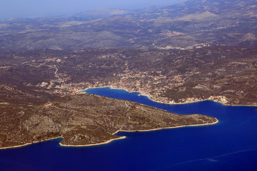 Vinisce from the bird's eye view: Water surface at the bay along the sea coast Adriatic Sea in Vinisce in Splitsko-dalmatinska zupanija, Croatia